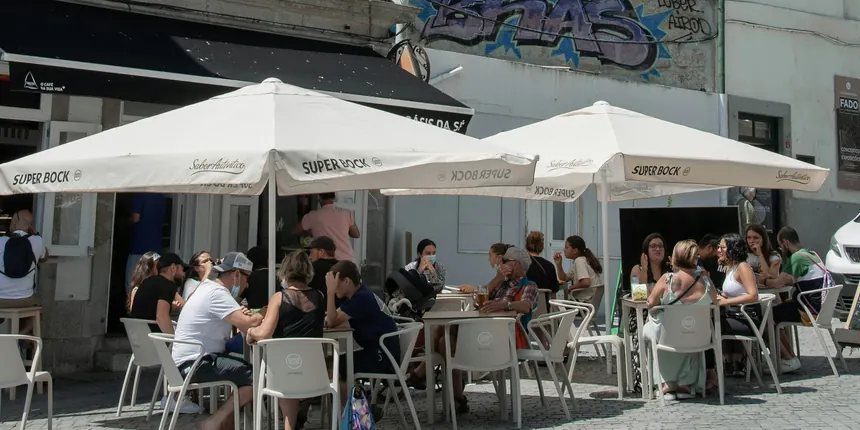 People sitting outside at a Portuguese cafe